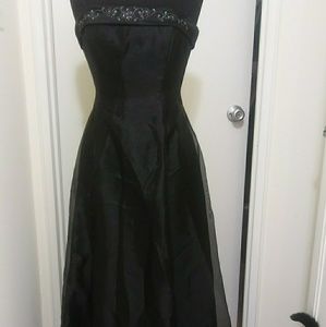 Black gown with sequin embellishments.